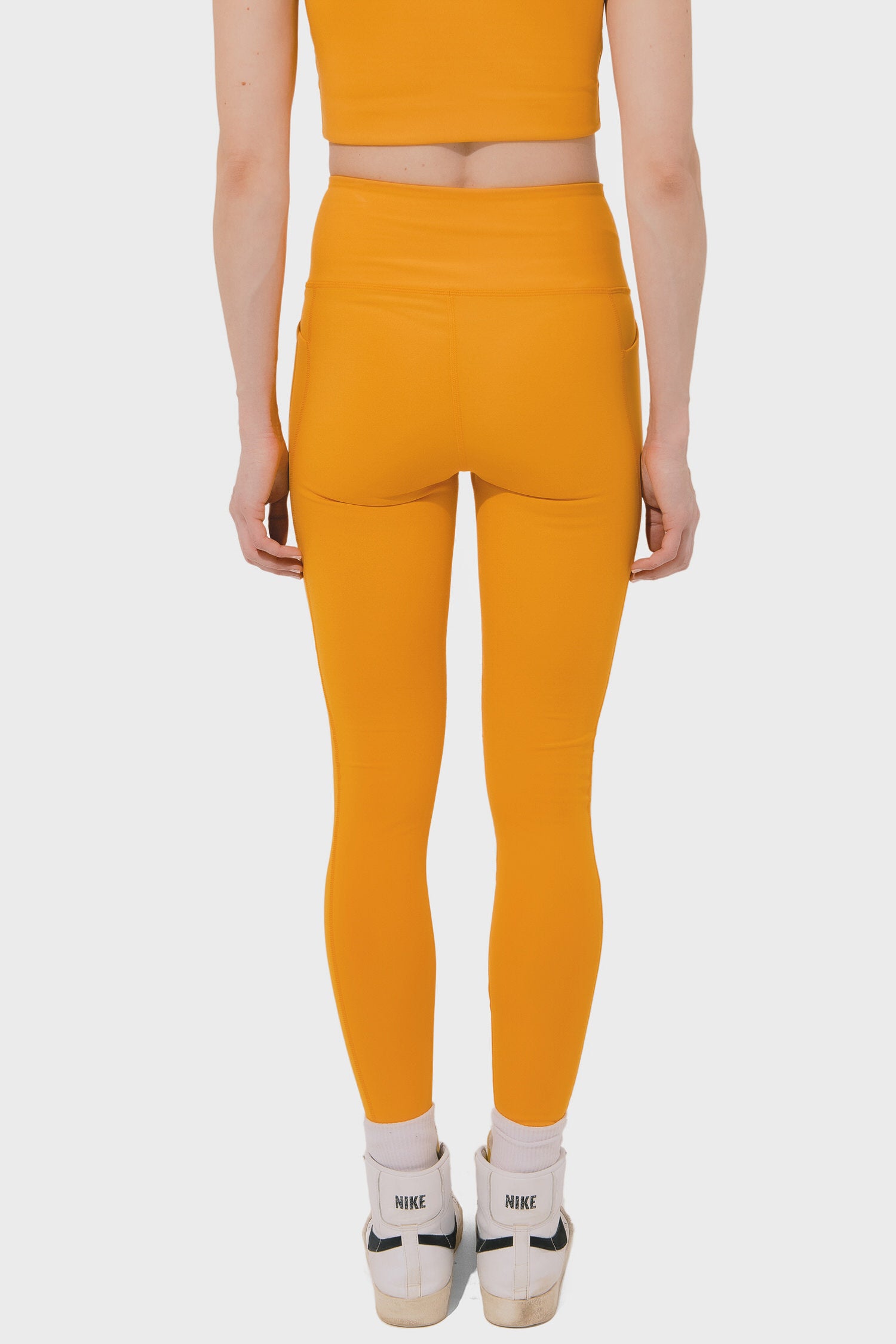 Women's Girlfriend Collective High Rise Compressive Pocket Legging in Golden Glow