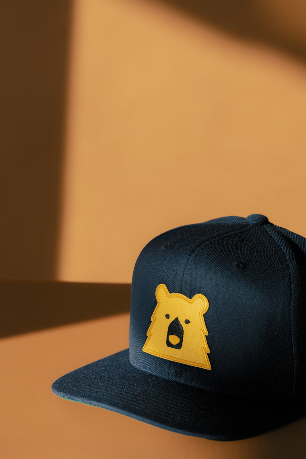 Black Bear Snapback in Navy/Golden Yellow